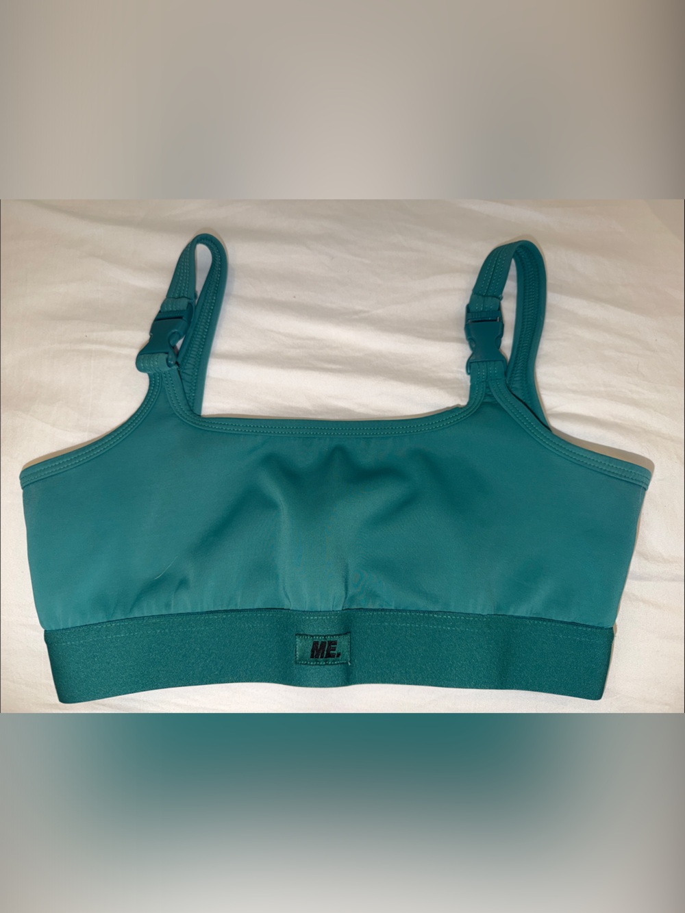 Melody Ehsani Utility Buckled Teal Sports Bra